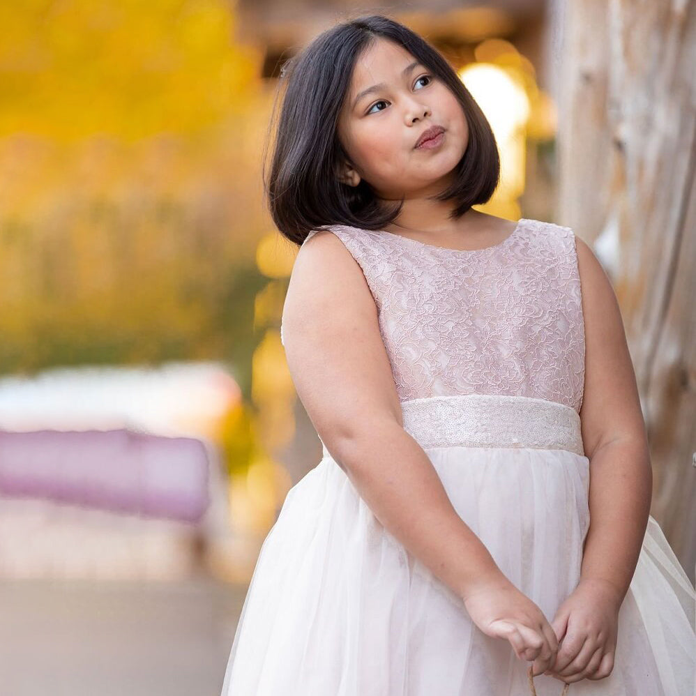 girl wearing Belle of The Ball lace and sequin dress