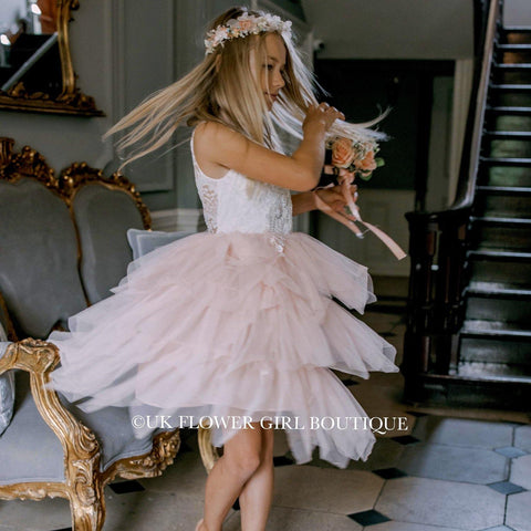 Girl dancing in hallway with flowers