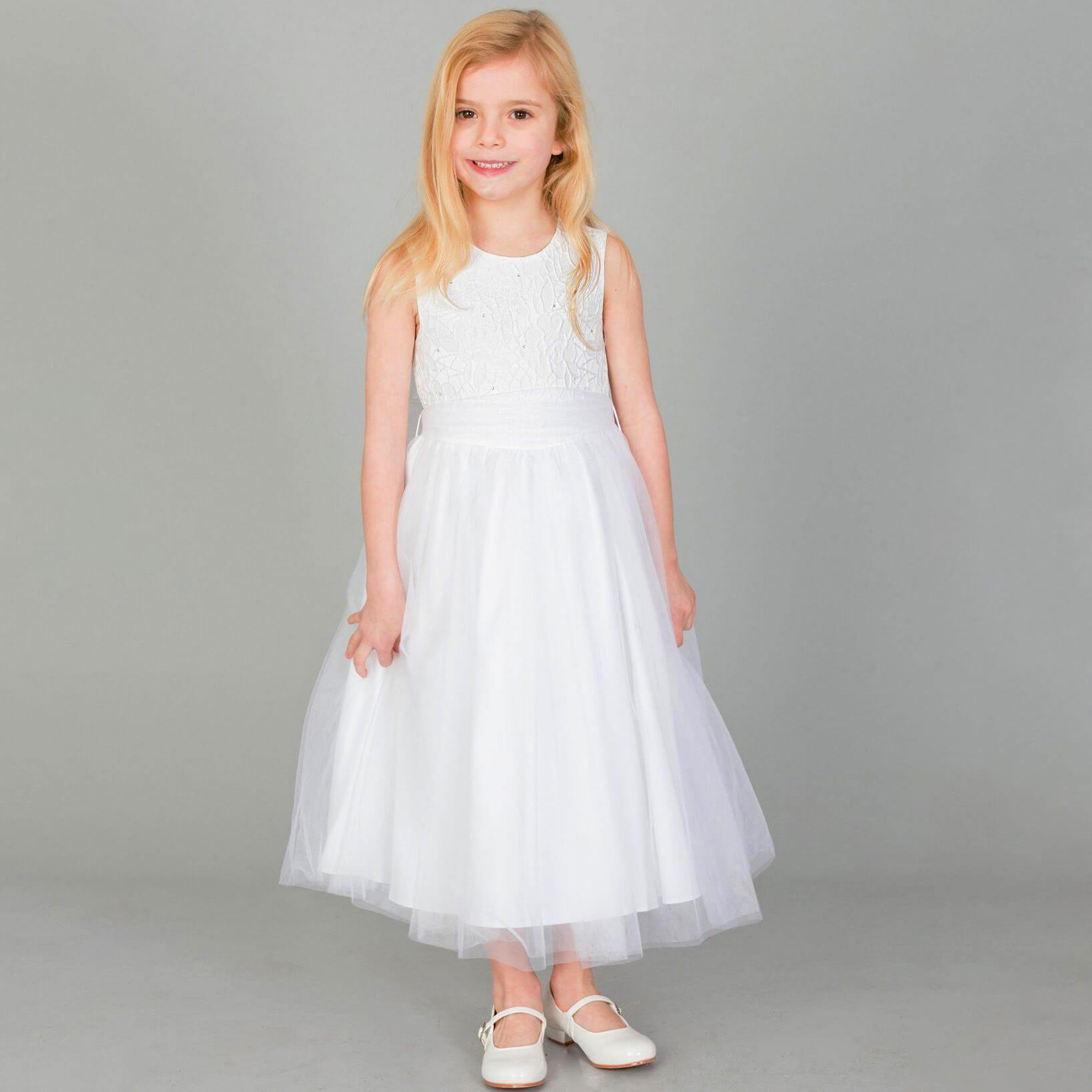Girl wearing a white party dress and shoes