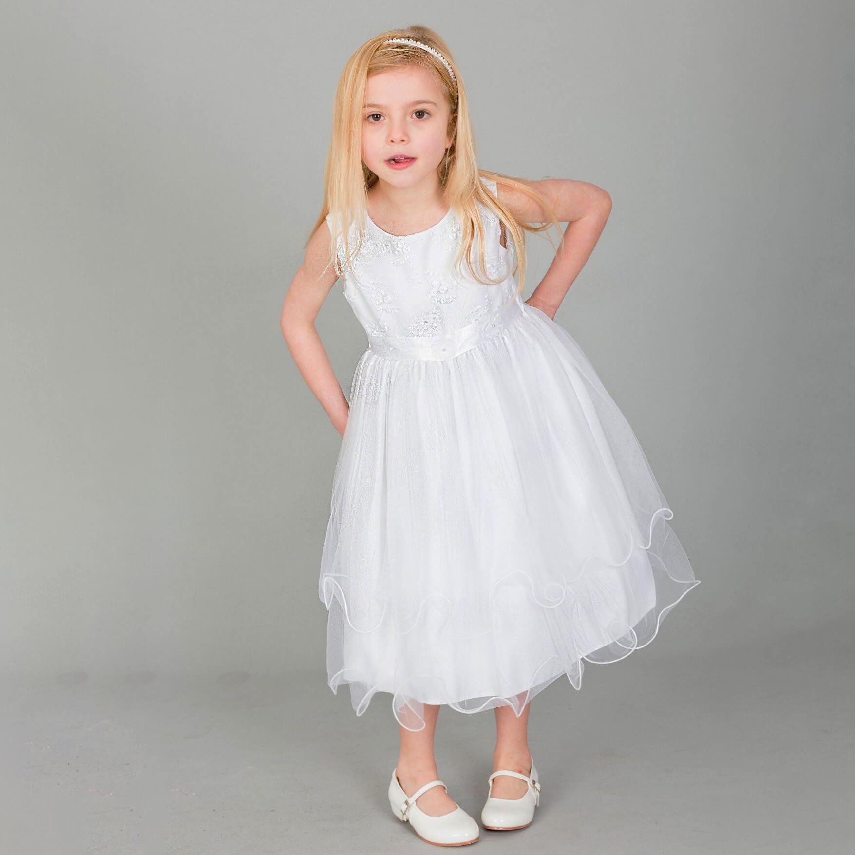 Girl wearing white Tiffany Flower Girl dress