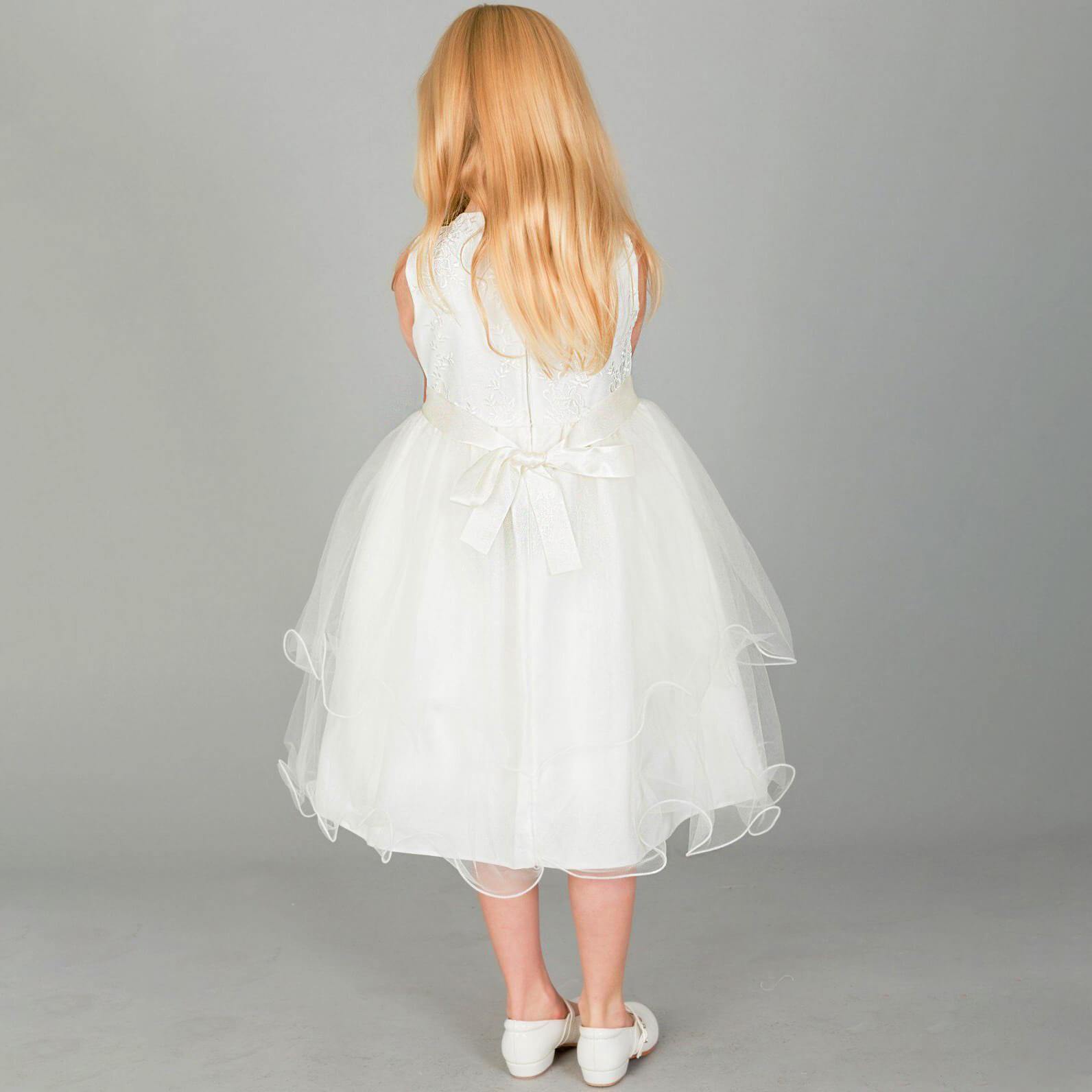 Girl wearing UK Flower Girl Boutique ivory coloured dress