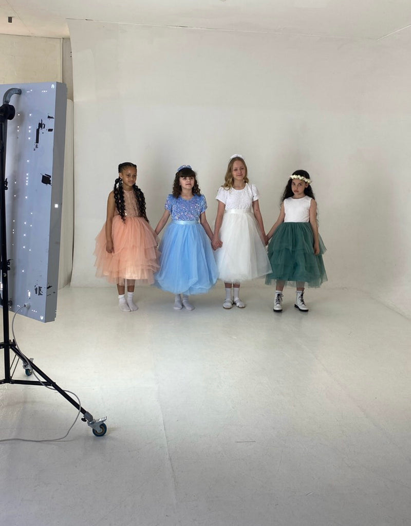 4 model children at a photo shoot