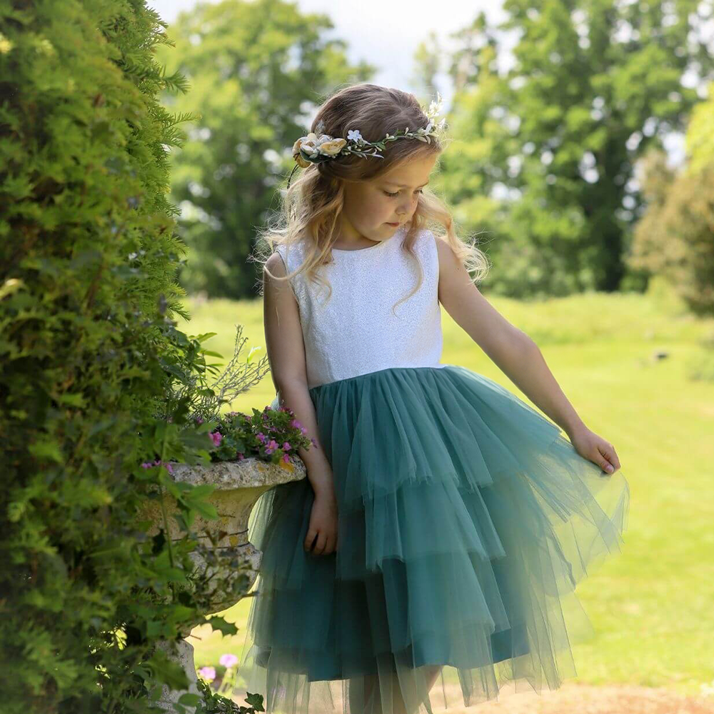 Young girl wearing a flower girl dress