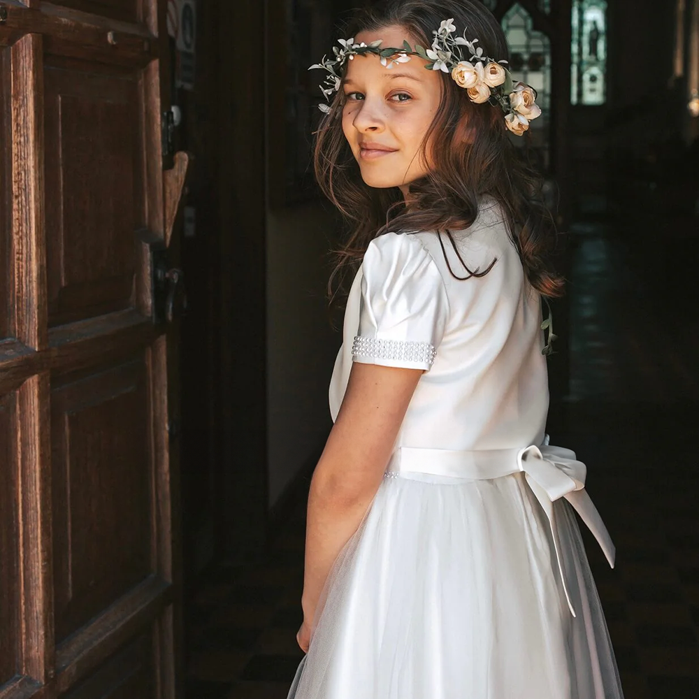Flower Girl wearing Harper Dress in a church