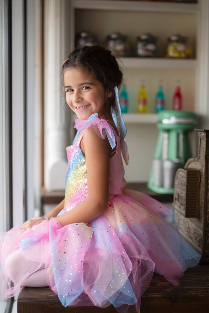 Child smiling dressed as a fairy 