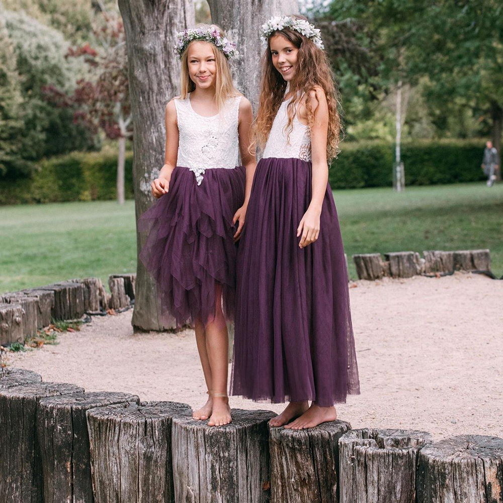 Two girls in purple flower girl dresses