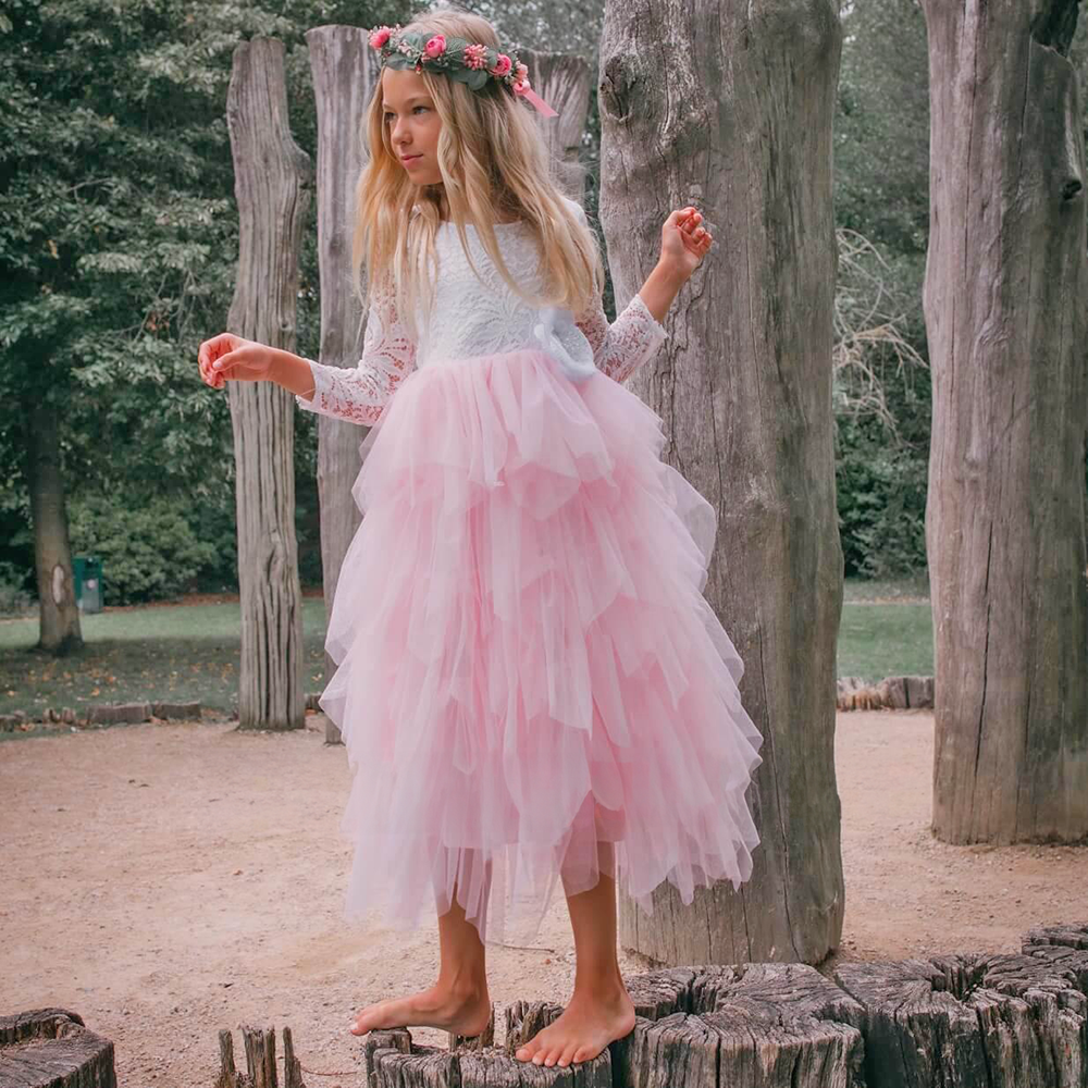 Flower Girl in Pink Dress standing on a log