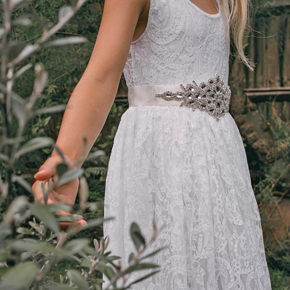 girl in a lace flower girl dress