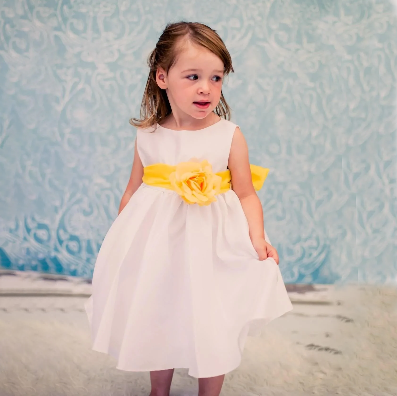 Little girl wearing Morgan Dress in white