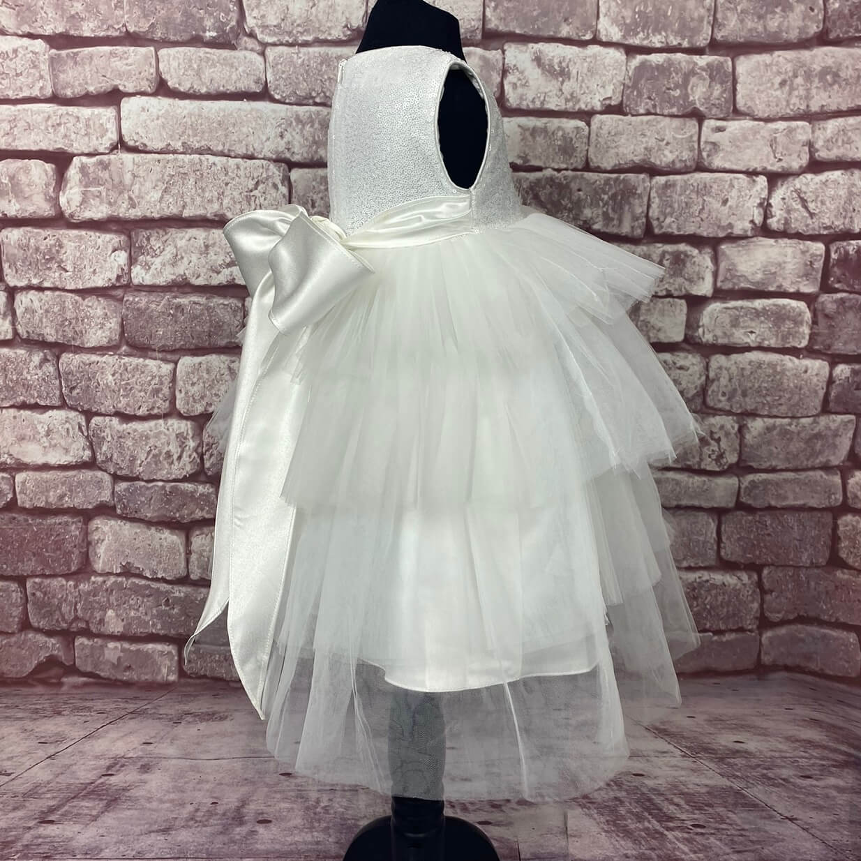 Side image of dark whit occasion dress