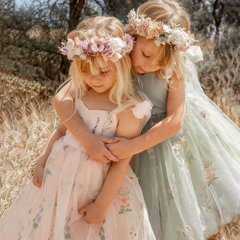 2 girls playing in pretty dresses