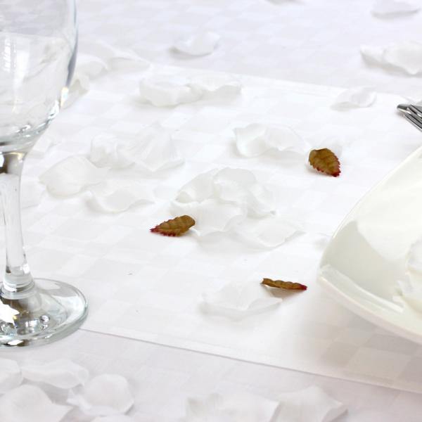 White petals on a white table cloth