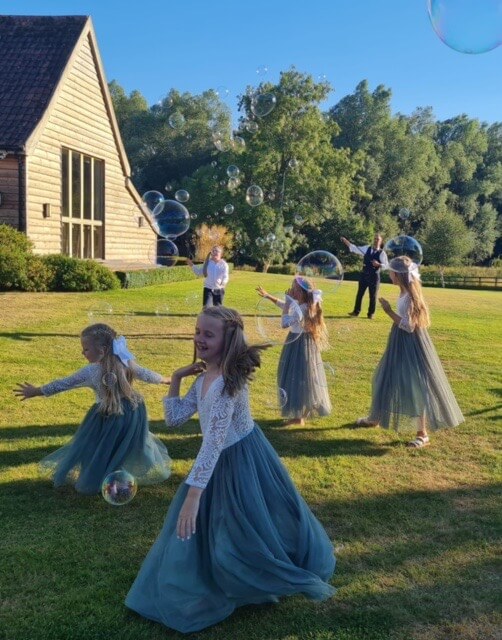 Girls in dresses playing
