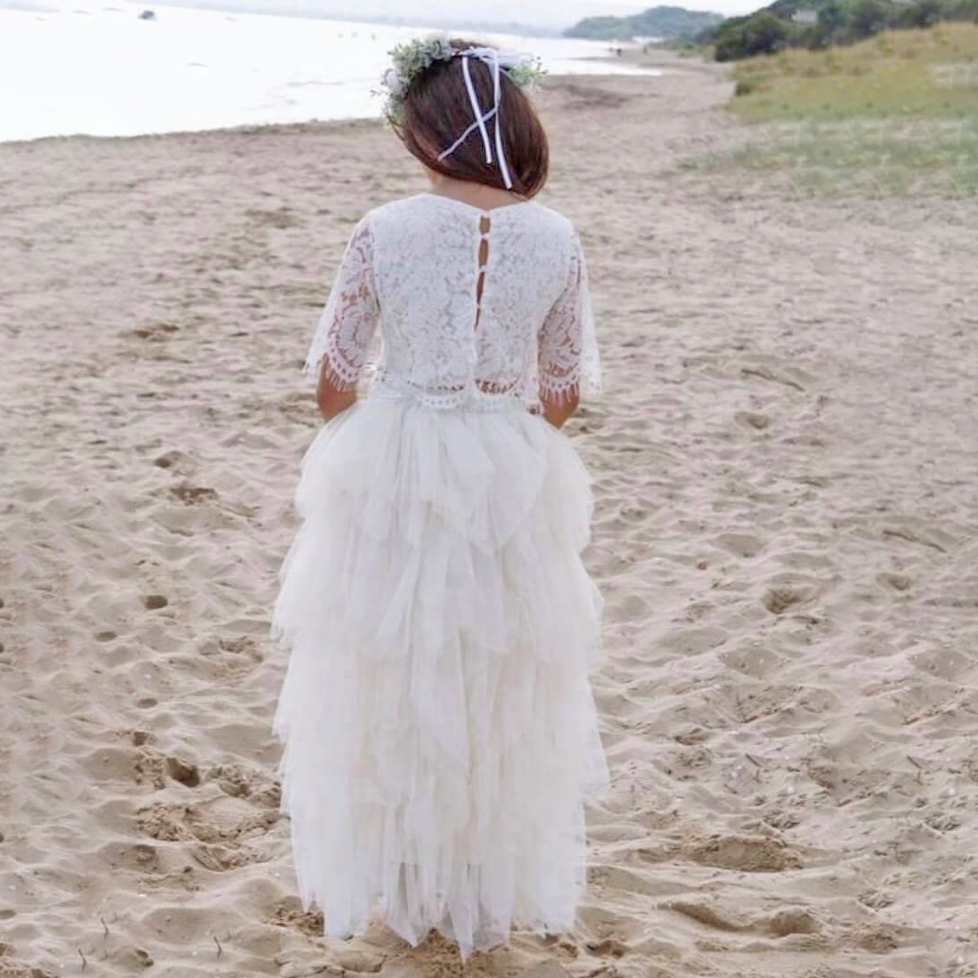 back of Ophelia Couture Set worn by a flower girl on the beach