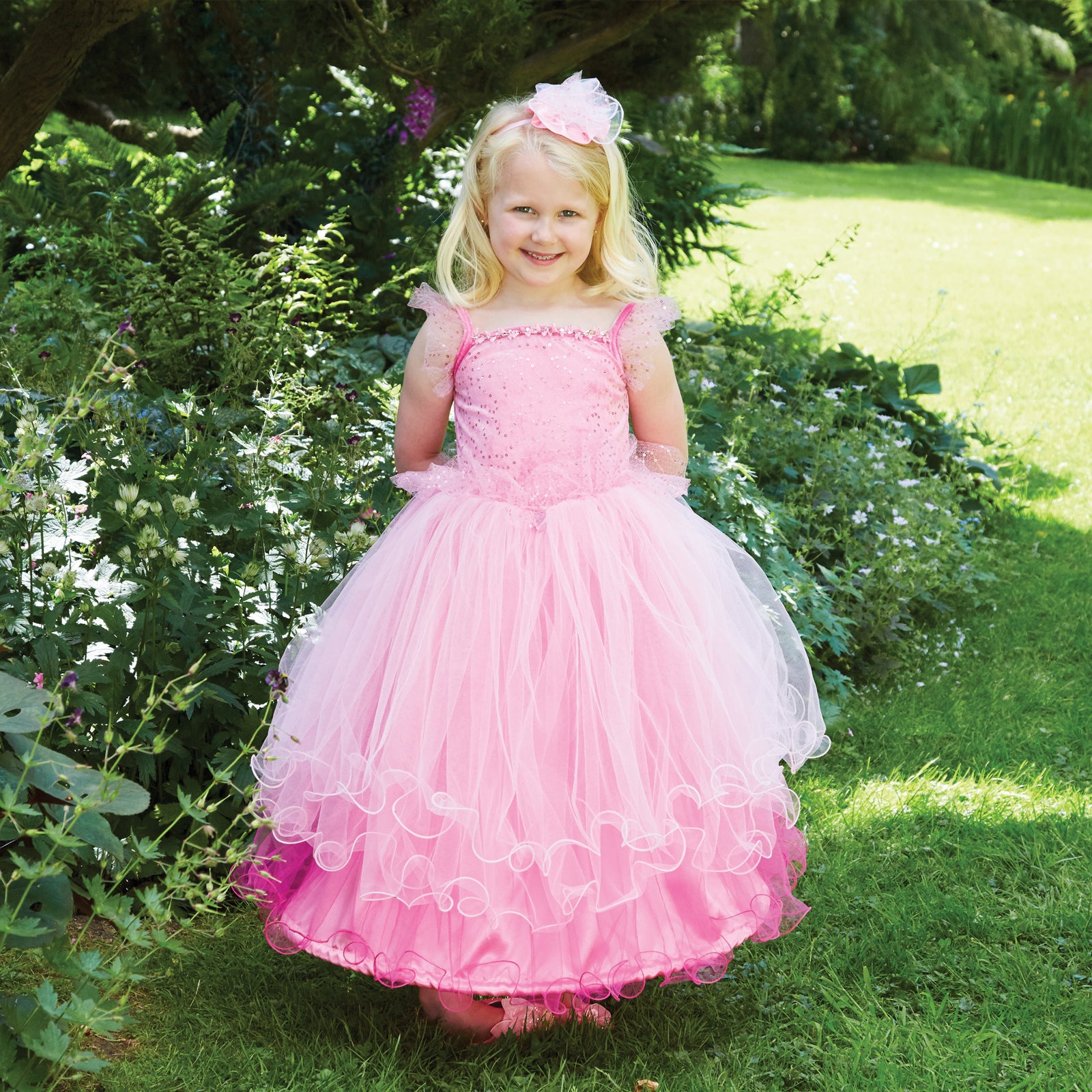 girl in a garden wearing a Pink Sweetheart Princess Dress