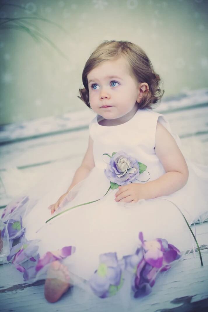 baby girl in petal dress