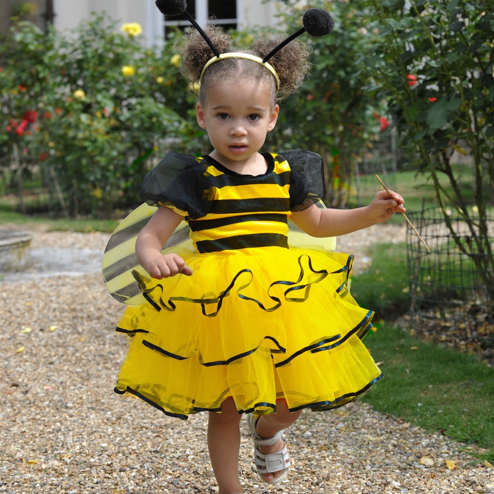 Girl wearing  a yellow three piece bumble bee costume