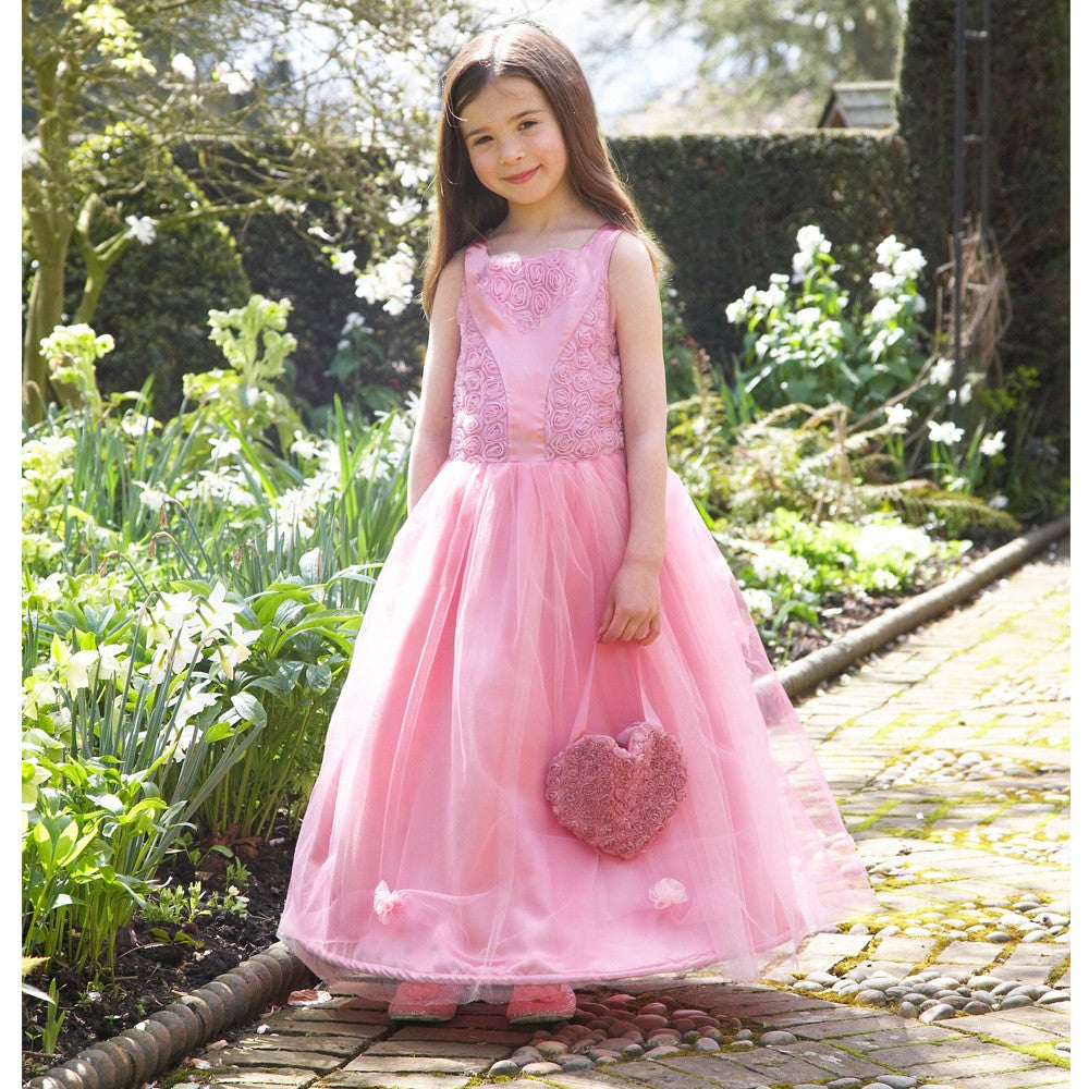 girl wearing a floral pink ball gown with matching bag