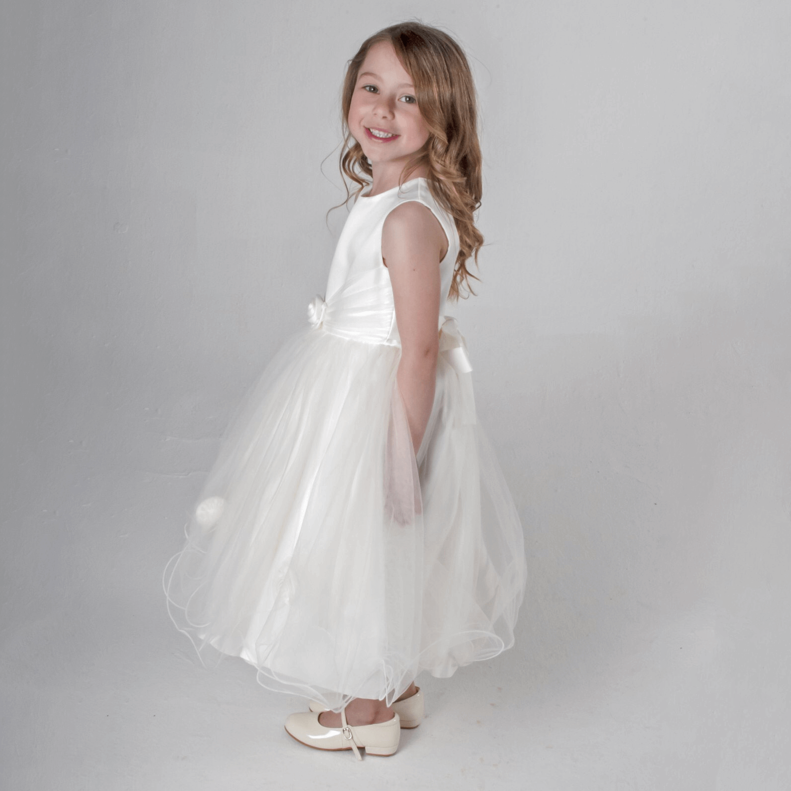 Lilly Dress in ivory being modelled by girl