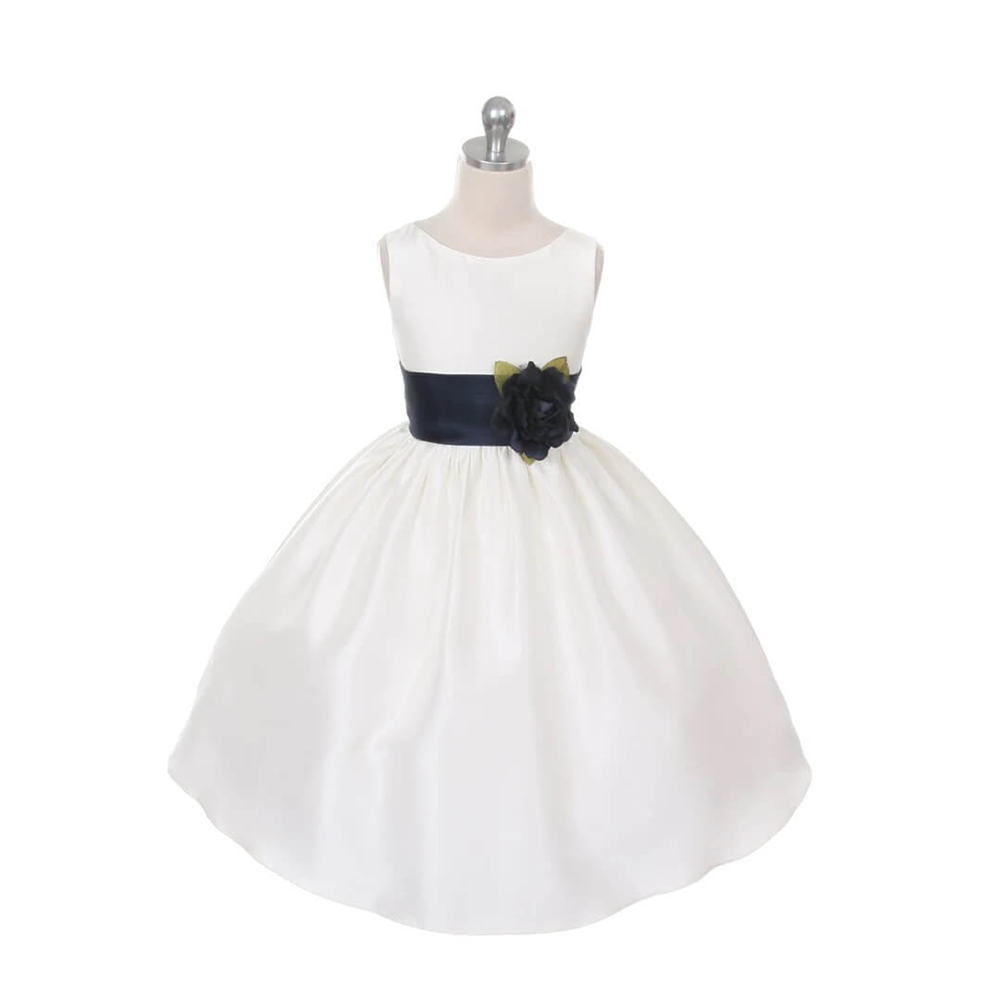 White flower girl dress with navy sash and flower